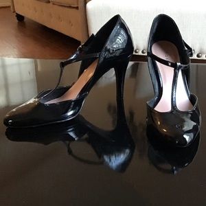 Black Synthetic Patent heels by Fioni.